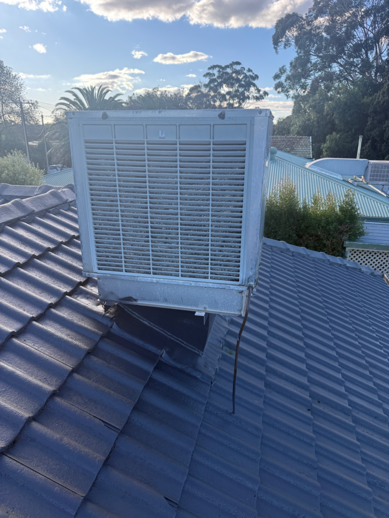 Original evaporative cooling unit on the roof of a residential home in Panorama before being replaced with a ducted reverse cycle air conditioning system.